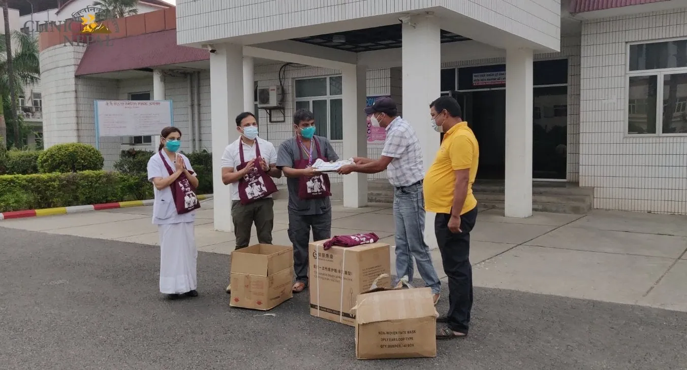 Hari hands out relief bags with information leaflets, masks and gloves during the Covid pandemic